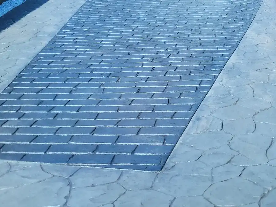 Pattern imprinted concrete installers at work